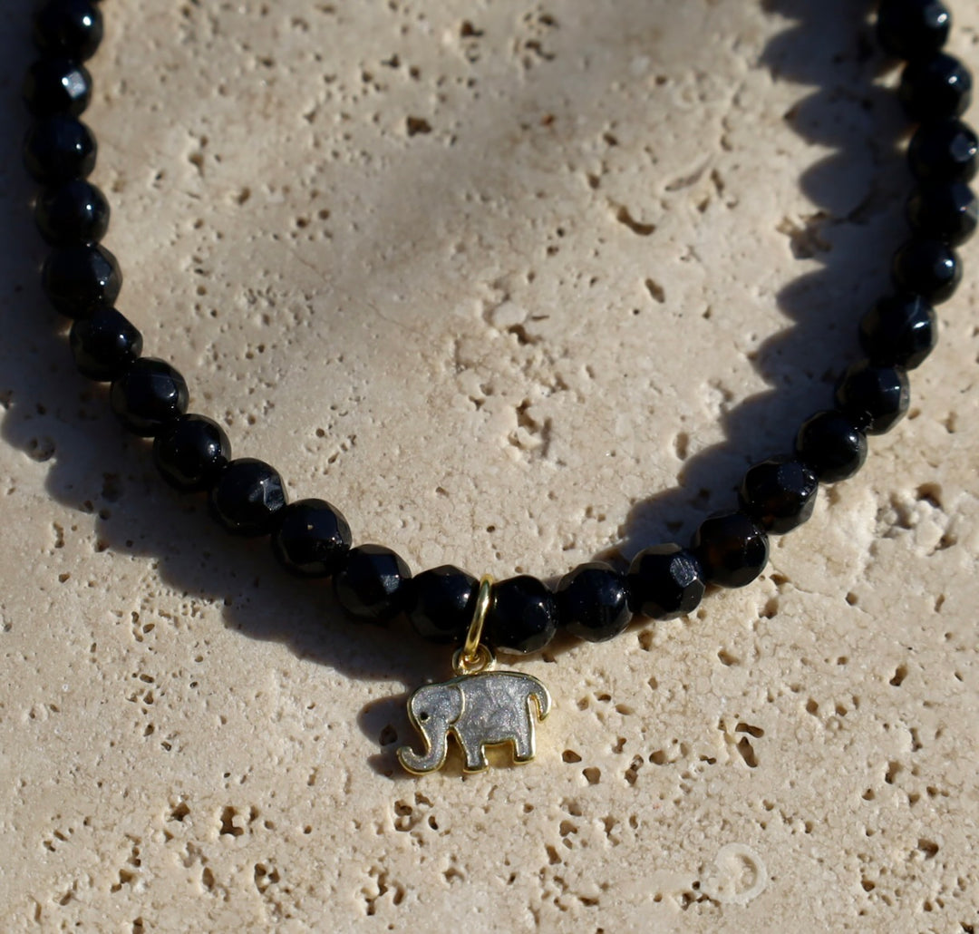 Onyx gemstone bracelet with elephant charm