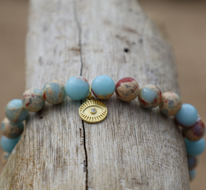 light blue agalmatolite gemstone bracelet with evil eye charm 